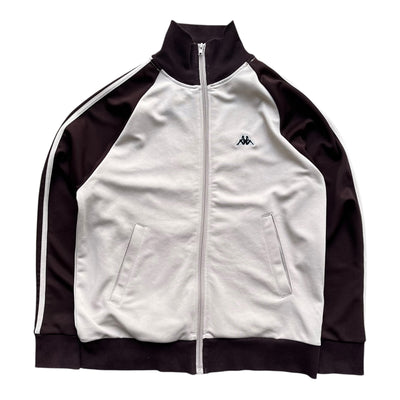 Kappa Vintage Track Jacke in Größe M, mit klassischen Kappa-Designs und Streifen auf den Ärmeln, in Schwarz und Weiß.