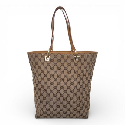Gucci GG Canvas Tragetasche mit Ledergriffen und Logo-Detail, stilvolle Einkaufstasche aus robustem Canvasmaterial.