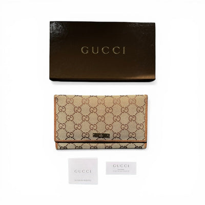 Gucci GG Canvas Geldbörse in Beige und Braun mit Lederdetails und goldfarbenen Akzenten, praktische Kartenfächer und Reißverschluss