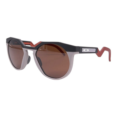 Oakley Latch Round Sonnenbrille mit mattschwarzem Rahmen, roten Armen und braunen Gläsern, klare Fassung, stilvoller Augenschutz